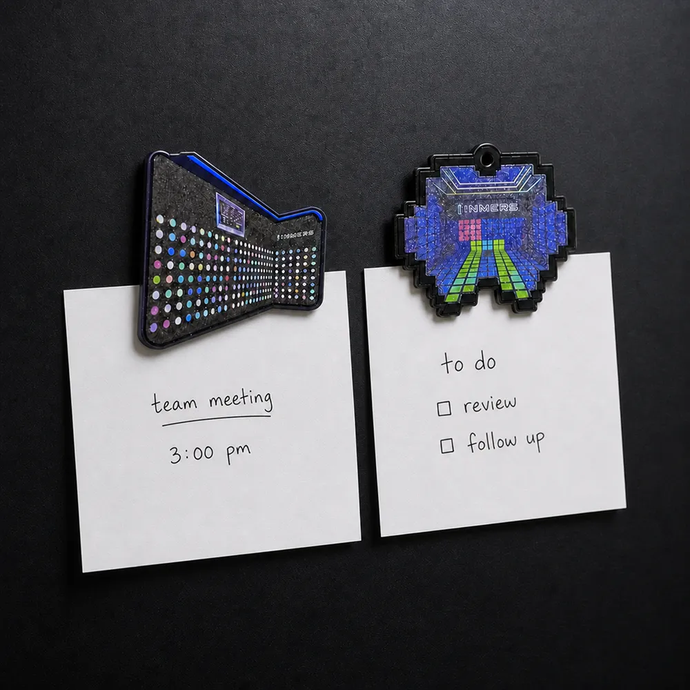 INMERS fridge magnets holding notes on a board
