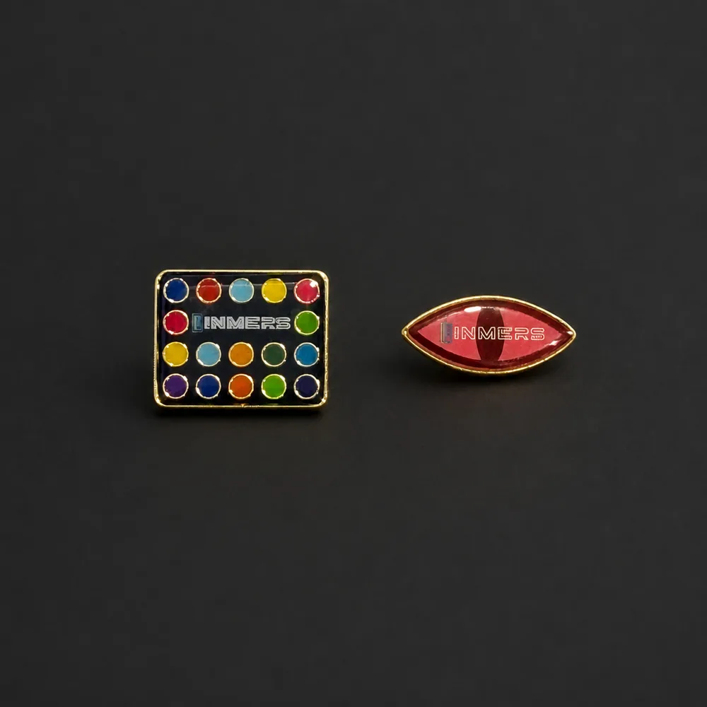 INMERS enamel pins featuring Line Line and Devil's Eye designs