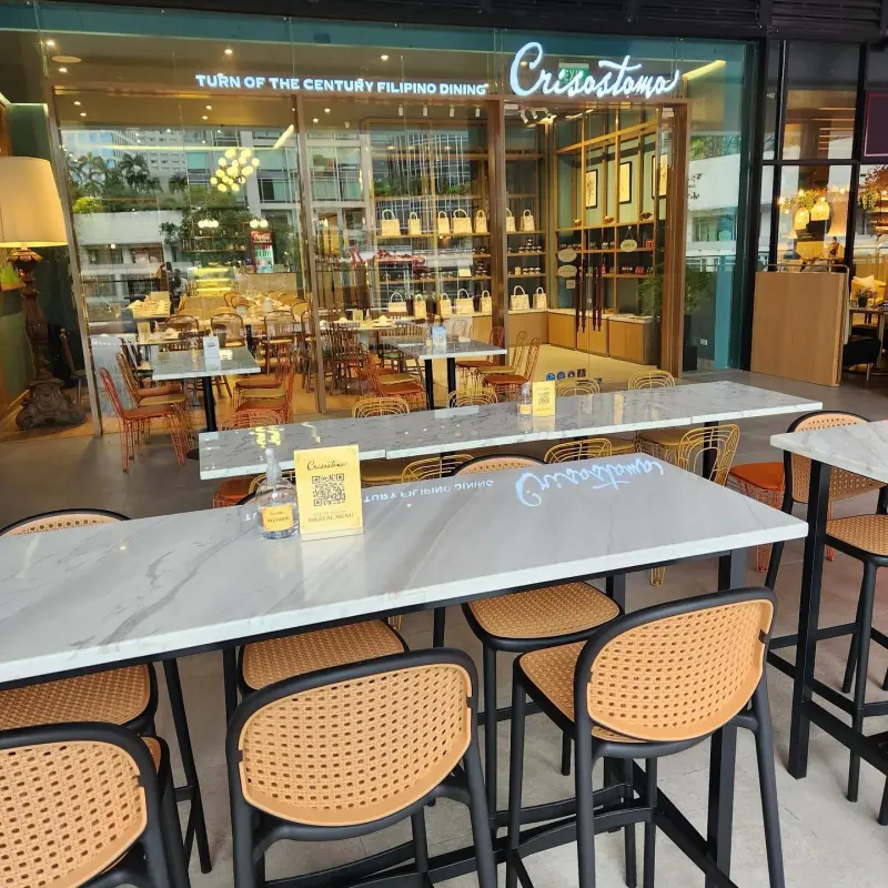 Crisostomo alfresco tables and Turn of the Century Filipino Dining signage at One Ayala Level 2