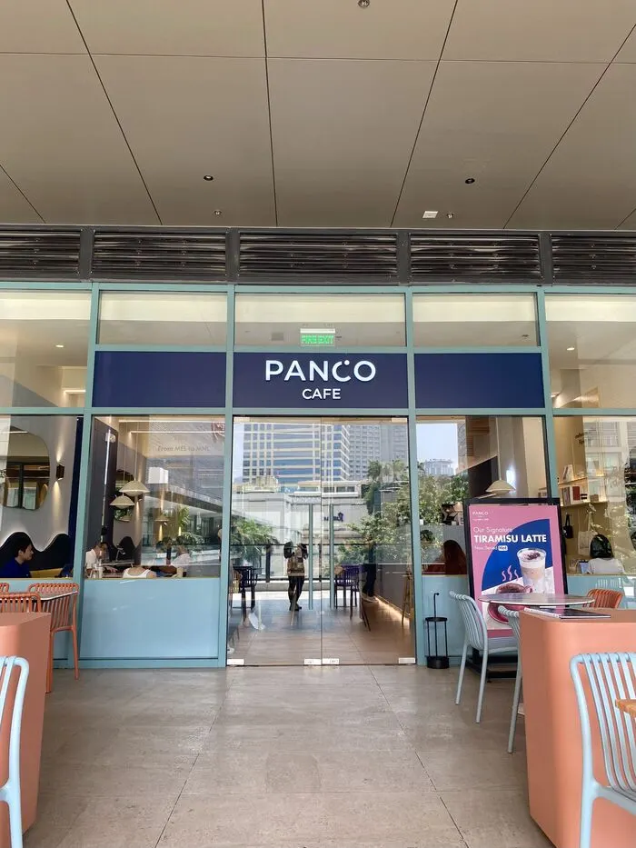 Panco Cafe storefront at One Ayala Level 2 with mint-green frames and alfresco seating